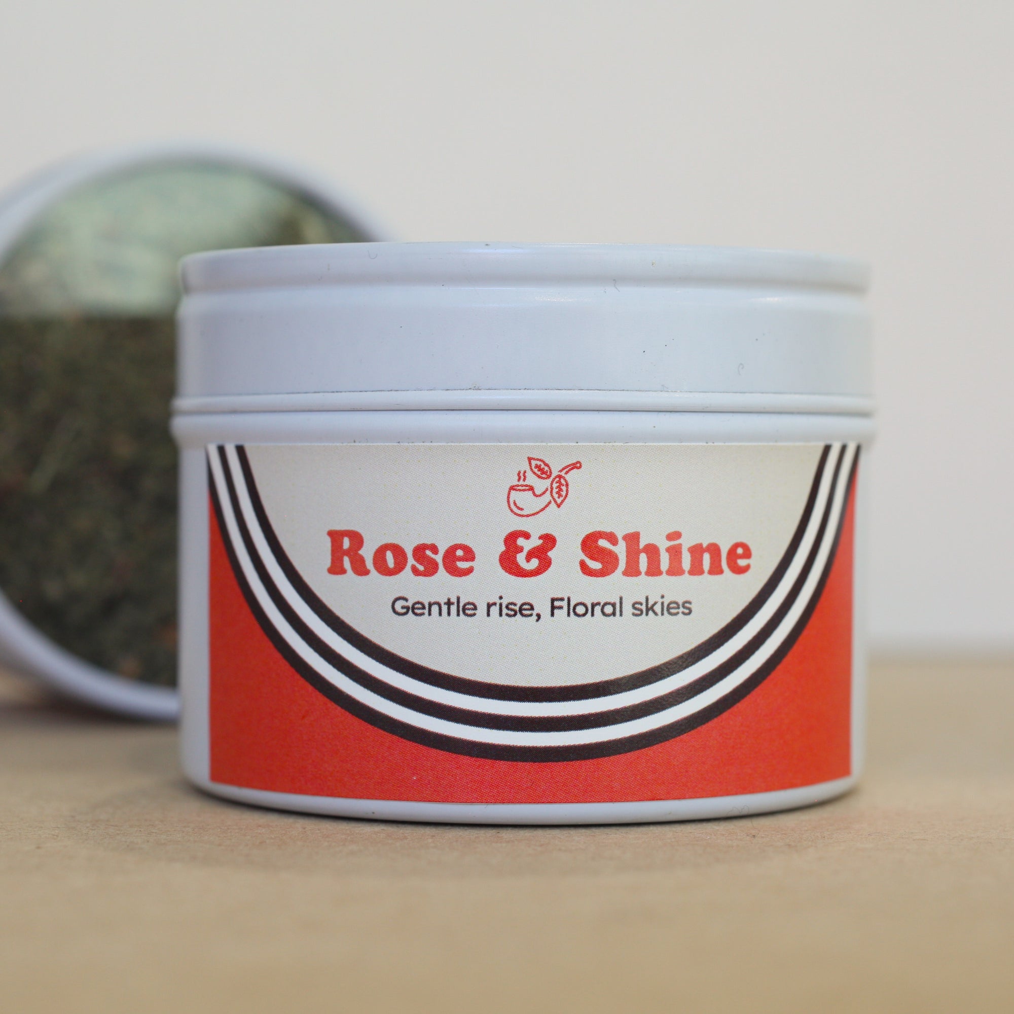 Nobacco Tobacco Substitute Container with 'Rose & Shine' label on a wooden surface